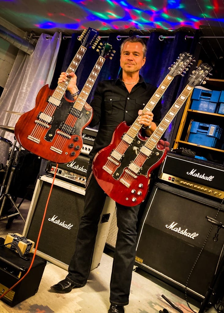 Staffan Österlind with two double neck guitars